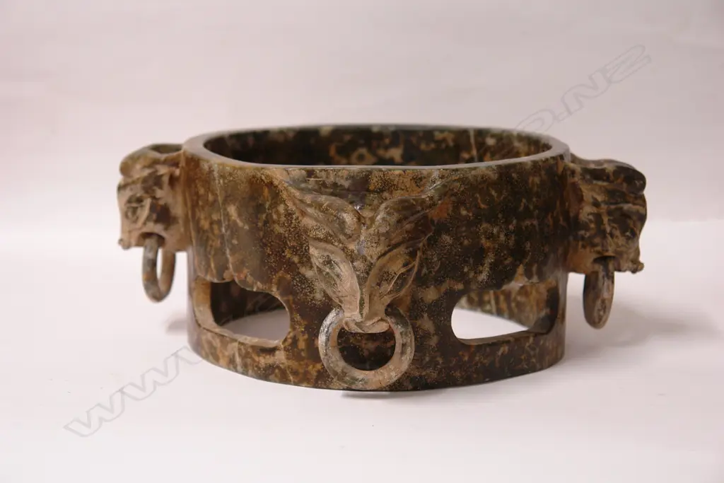 A Chinese green stone carved open cylinder Image 1++