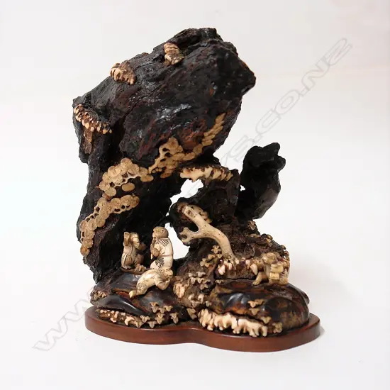 A Japanese gnarled wood and bone grotto type carving