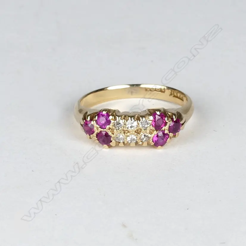 An N.Z. 18ct. gold diamond and faux ruby ring Image 1++