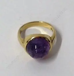An 18ct. gold and pink sapphire ring Image 1++