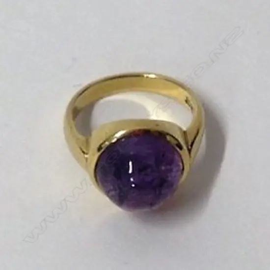 An 18ct. gold and pink sapphire ring