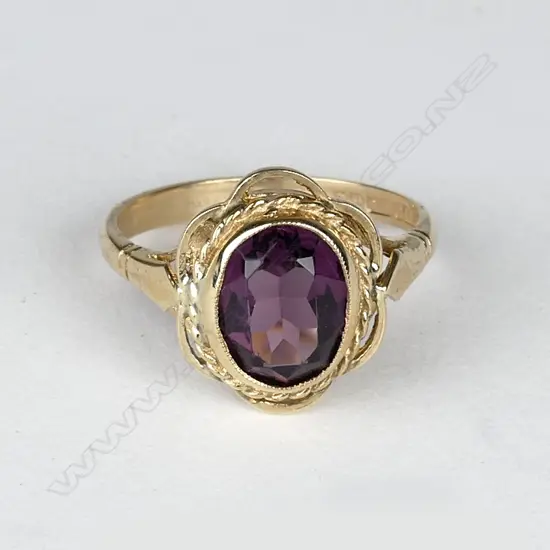 A 9ct. gold and amethyst ring