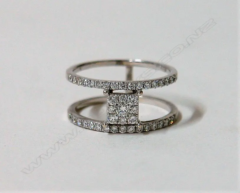 A lady's modern 14ct. white gold and diamond cluster and double band ring Image 1++