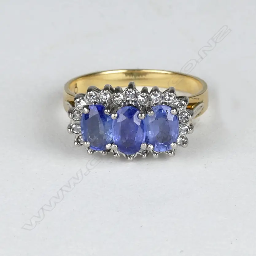 An 18ct. gold sapphire and diamond ring Image 1++