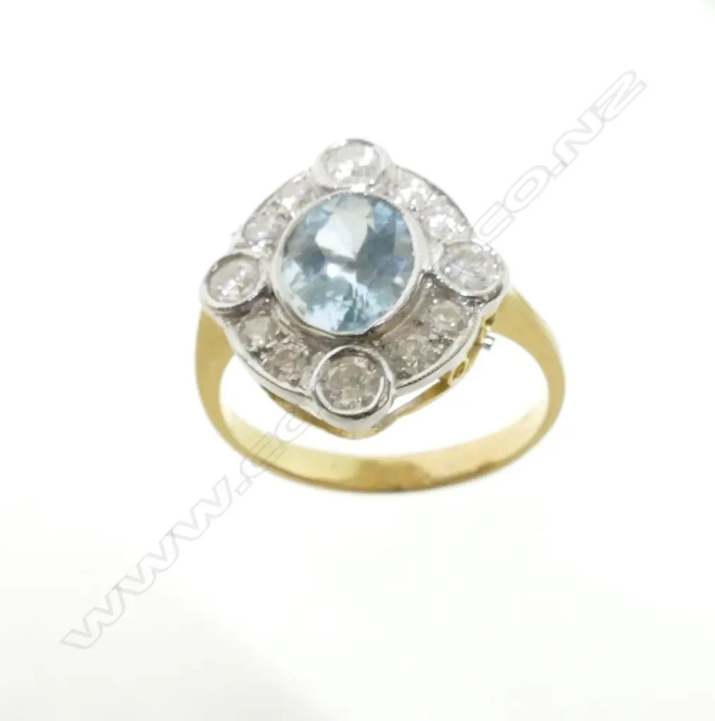 An Art Deco style 18ct. gold diamond and aquamarine ring Image 1++
