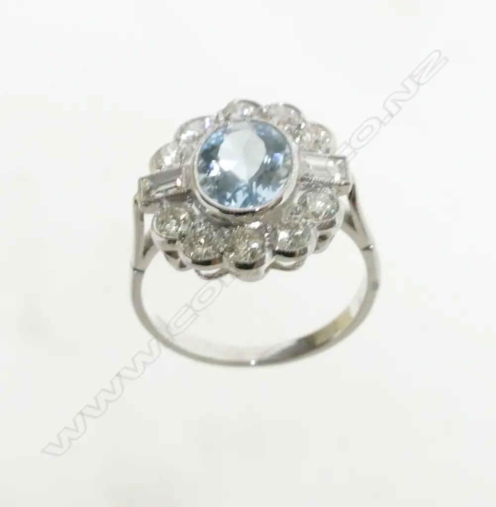 An Art Deco style 18ct. white gold diamond and aquamarine ring Image 1++
