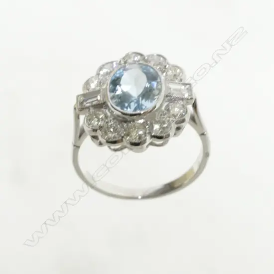 An Art Deco style 18ct. white gold diamond and aquamarine ring