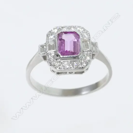An Art Deco style 18ct. white gold diamond and pink sapphire ring