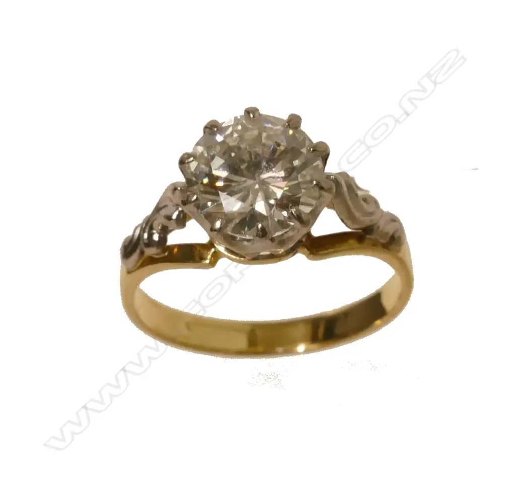 An 18ct. gold and diamond solitaire ring Image 1++