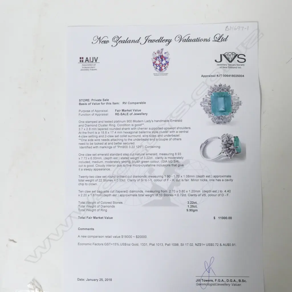 A platinum emerald and diamond ring Image 1++