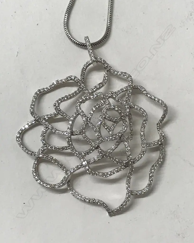 A modern 18ct. white gold and diamond pendant Image 1++