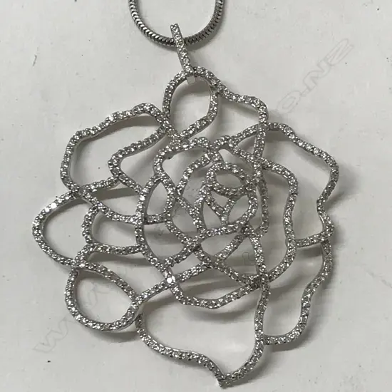 A modern 18ct. white gold and diamond pendant