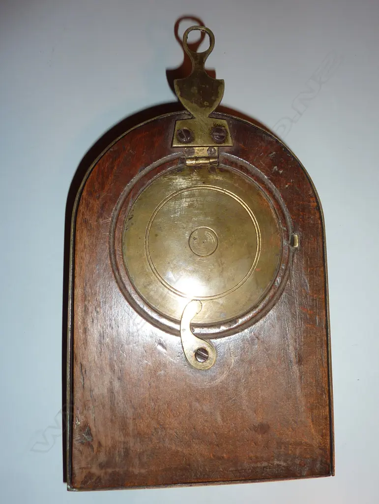 A sedan chair clock with brass bound 'milestone' case and traditional hanger and latched hinged back flap to permit rear winding with included key Image 1++