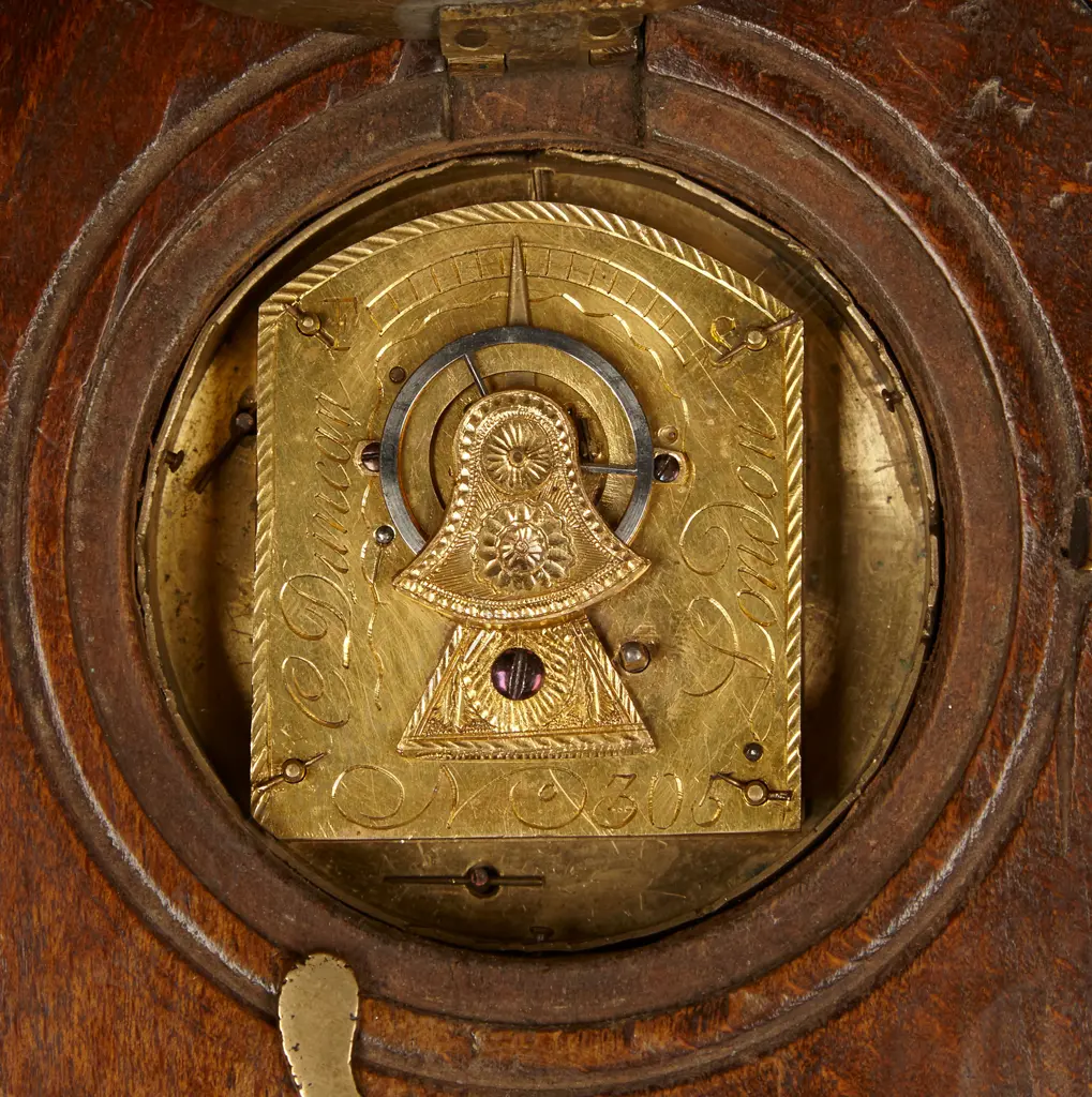 A sedan chair clock with brass bound 'milestone' case and traditional hanger and latched hinged back flap to permit rear winding with included key Image 1++
