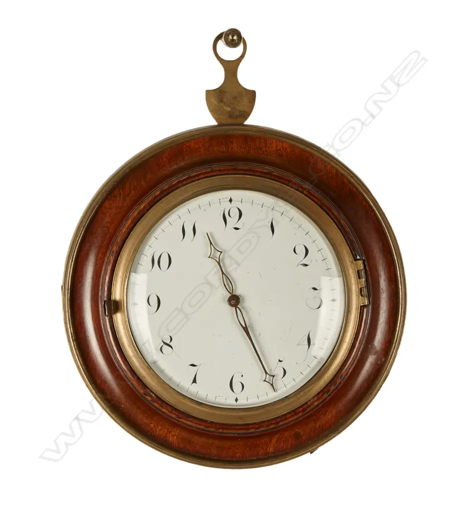 A sedan chair clock with circular turned mahogany case and traditional hanger and latched hinged back flap to permit rear winding with included key Image 1++