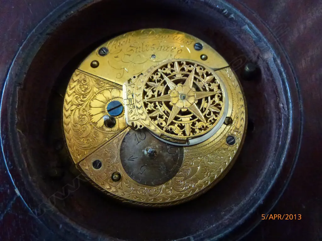 A sedan chair clock with circular turned mahogany case and traditional hanger and latched hinged back flap to permit rear winding with included key Image 1++