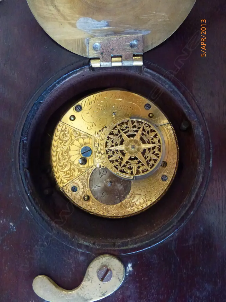 A sedan chair clock with circular turned mahogany case and traditional hanger and latched hinged back flap to permit rear winding with included key Image 1++