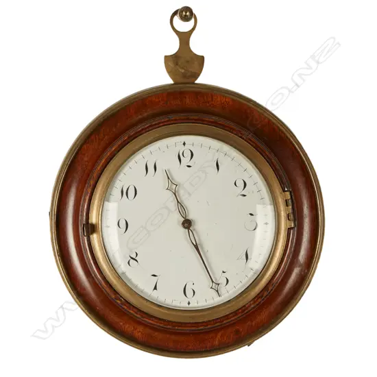 A sedan chair clock with circular turned mahogany case and traditional hanger and latched hinged back flap to permit rear winding with included key