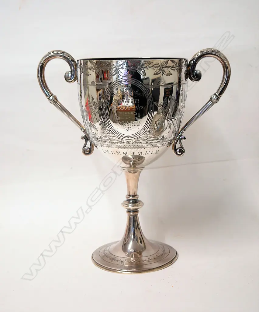 A large Victorian silver Aesthetic period and decorated trophy cup Image 1++