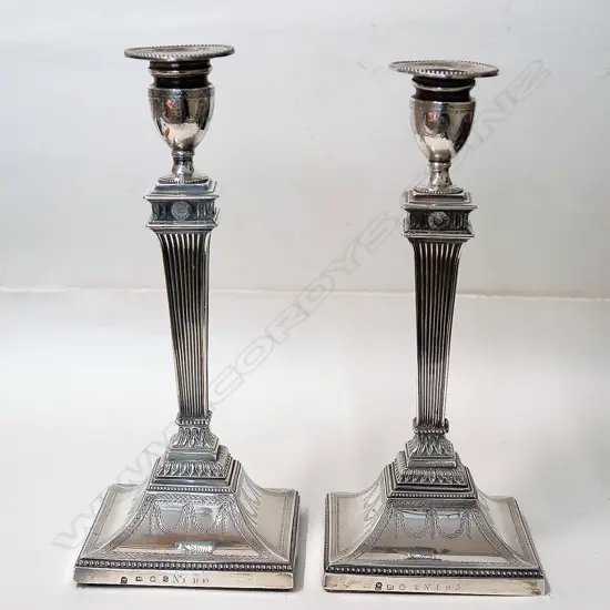 A pair of George III silver column candlesticks in the Adam's style