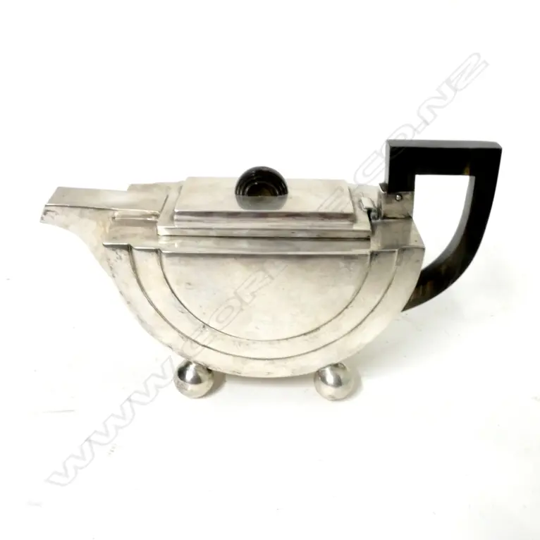A heavy stylish sterling silver teapot Image 1++