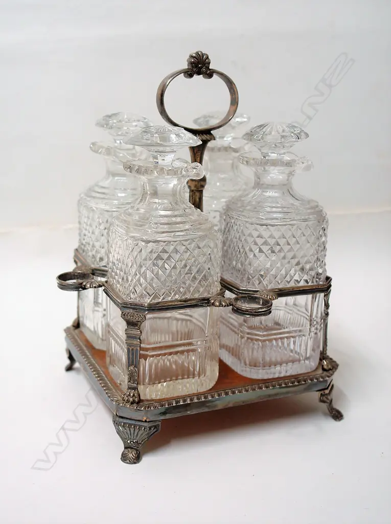 A Victorian silver plate four cut glass bottle decanter Image 1++