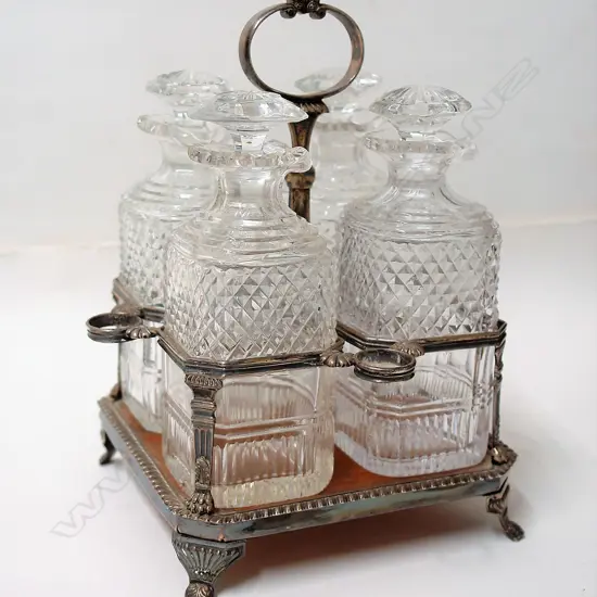 A Victorian silver plate four cut glass bottle decanter
