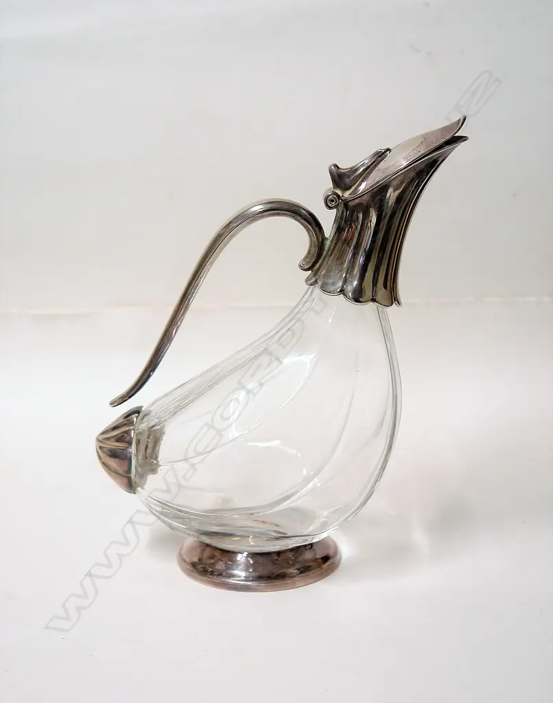 A silver plate and glass bodied wine decanter Image 1++