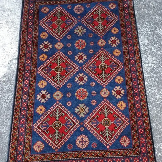 A small hand knotted Persian rug