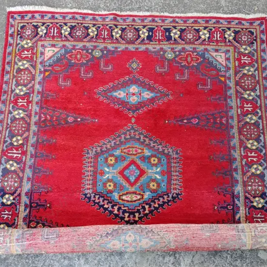 A hand knotted Persian Hamadan rug