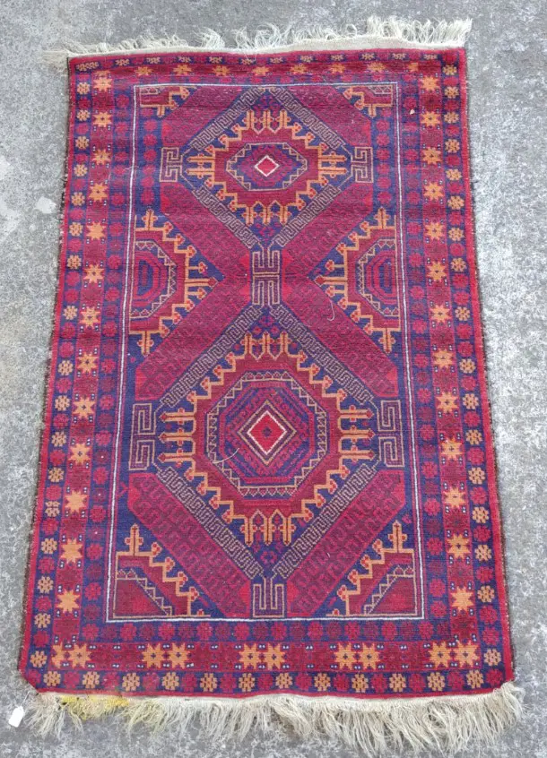 A small hand knotted Baluchi tribal rug Image 1++