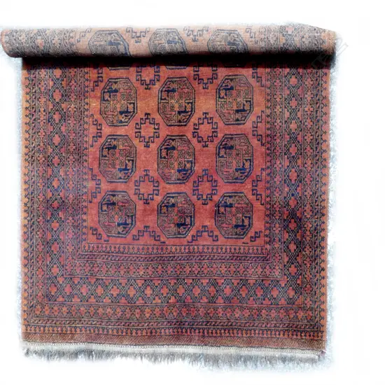 A large hand knotted Afghan Bokhara rug