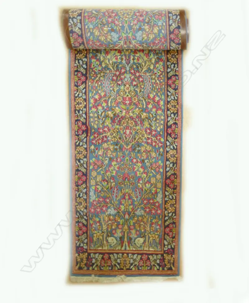 A narrow hand knotted Persian Kerman runner Image 1++