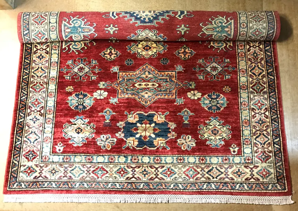 A hand knotted Kazak rug Image 1++