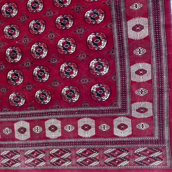 A large old good quality Persian Tekke Turkoman carpet