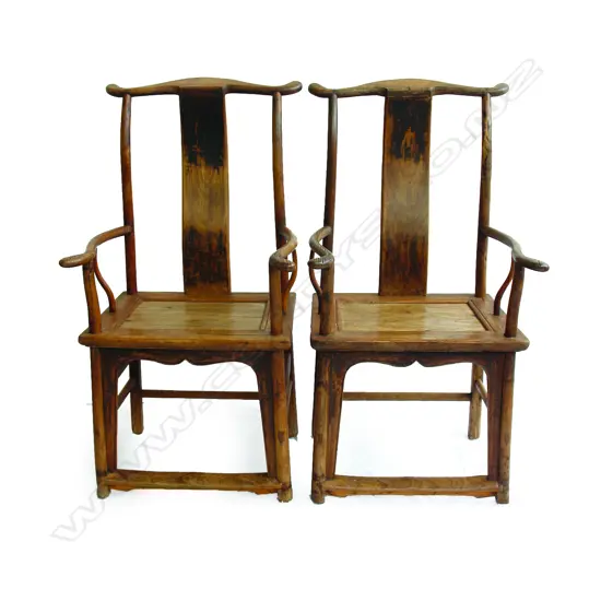 A pair of vintage Chinese yoke back chairs