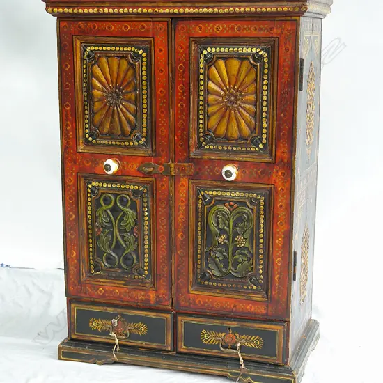 A vintage Tibetan two-door cabinet