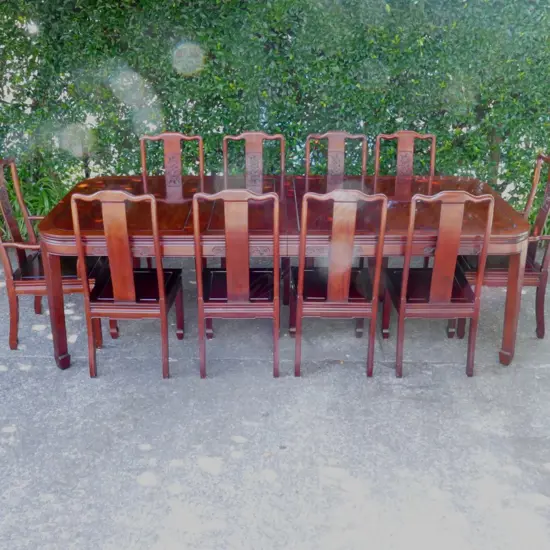 A Chinese rosewood extension banquet dining table and ten chairs