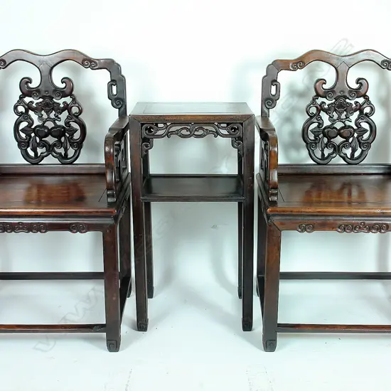 A pair of late 19th/early 20thC Chinese rosewood Tai Shi armchairs and matching tea table