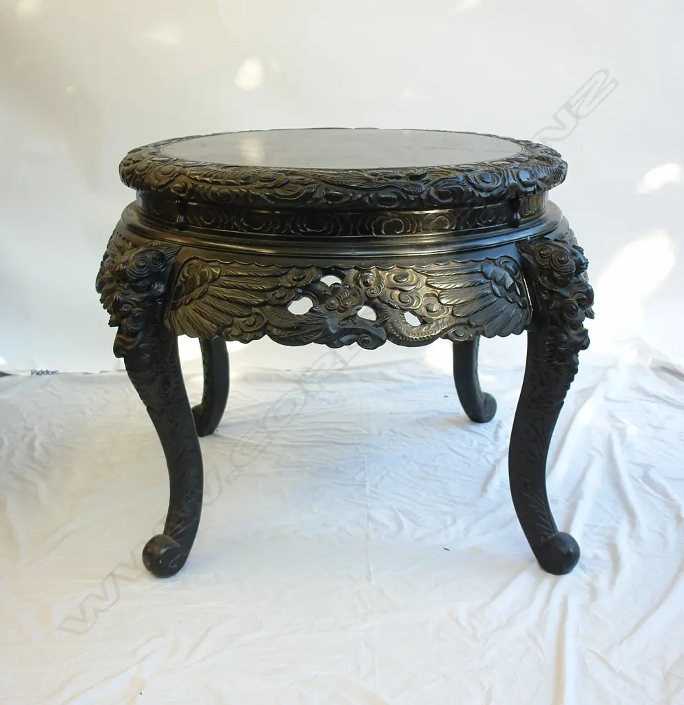 A vintage Oriental carved and black lacquer centre table Image 1++
