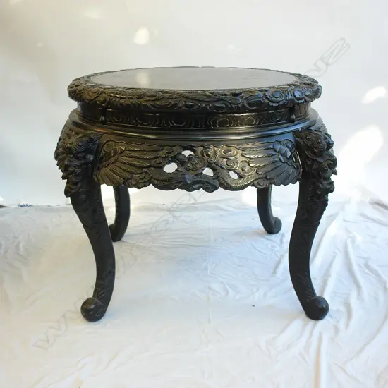 A vintage Oriental carved and black lacquer centre table
