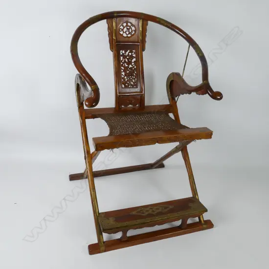 A pair of rare old Huanghuali Chinese folding horseshoe-back armchairs