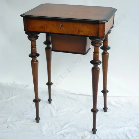 A 19thC European burr walnut work table