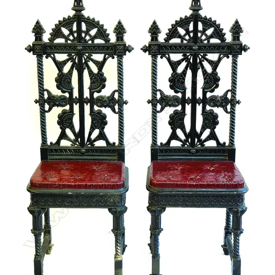 A pair of  Coalbrookdale cast iron hall chairs designed by Christopher Dresser c.1870 in the 'Lily' pattern