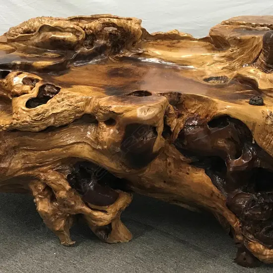 A heavy  burr root timber desk