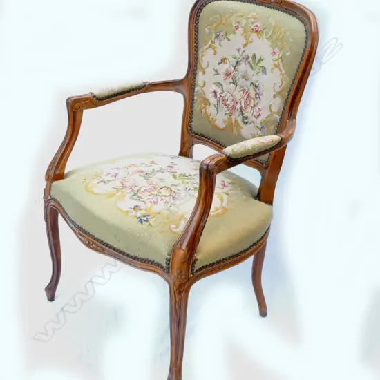 A walnut open elbow chair