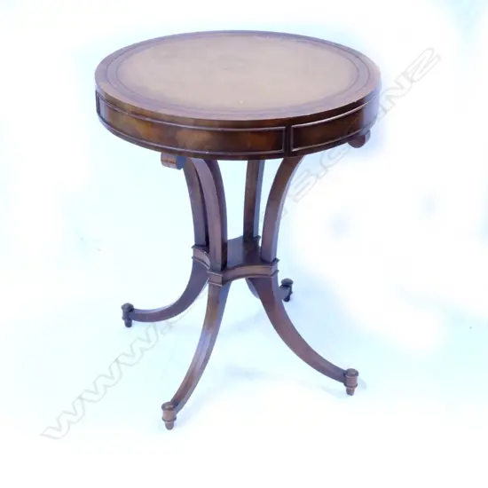 A small mahogany drum top centre table