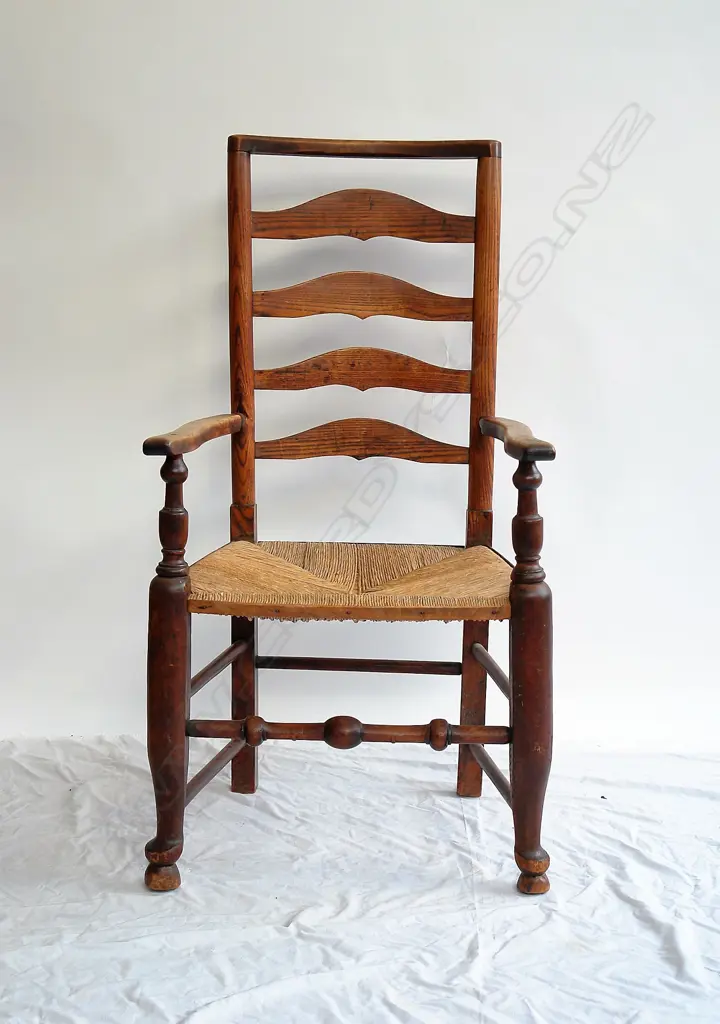 An early 19thC elm and beech country ladder back armchair Image 1++