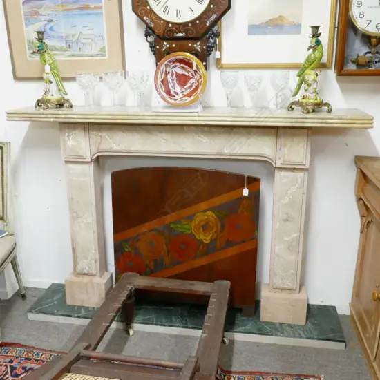 A classical coloured marble fire surround