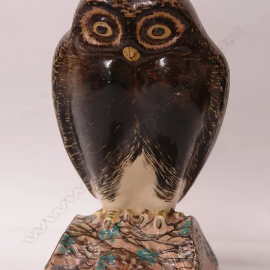 A late 19thC European sculpted and glazed china owl vase ornament